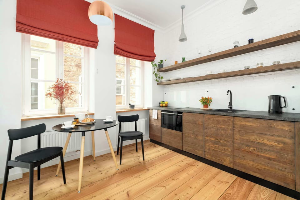 Fully equipped kitchen with modern cabinetry and industrial-style details.