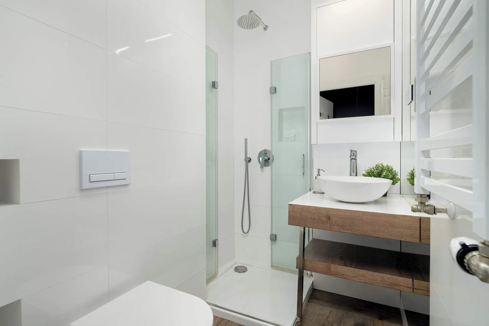 Clean, elegant bathroom with a modern touch — perfect for a refreshing start to your day.