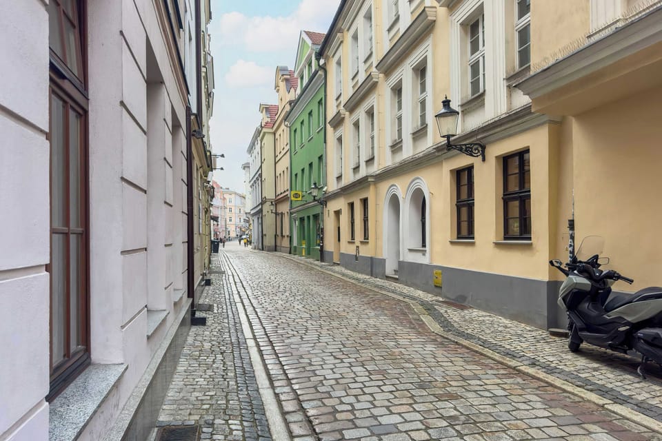 A paved street with historic buildings.