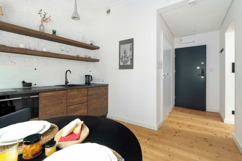 Next to the modern kitchenette there is a dining table where you can enjoy your prepared meals.