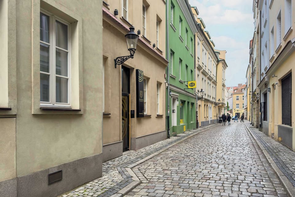 A paved street with historic buildings.