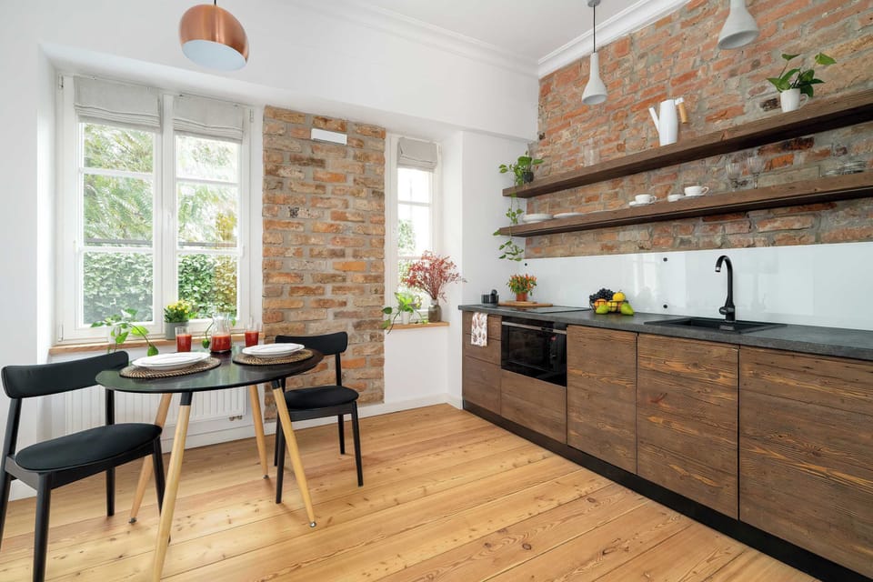 Fully equipped kitchen with modern cabinetry and industrial-style details.