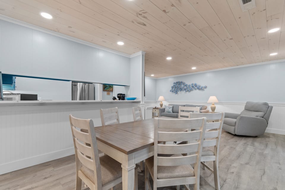 Your bright, open-concept living space invites family meals at the stylish dining table while the kitchen awaits your culinary adventures.
