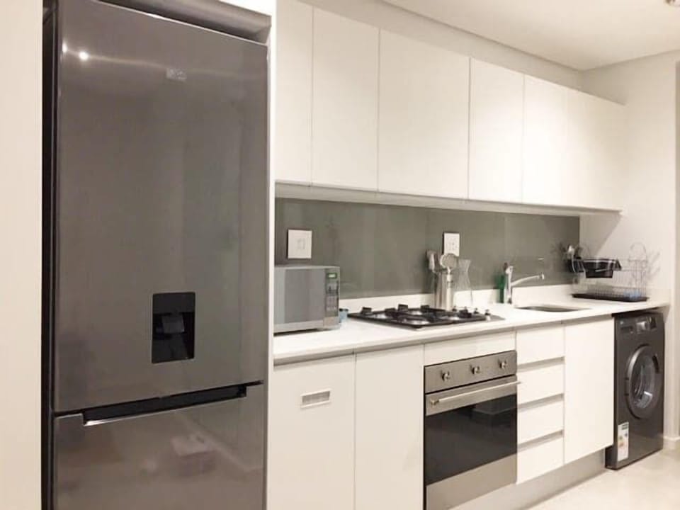 Full kitchen featuring Smeg appliances. There is a washer for guests who wish to do their own laundry. There is also a laundromat close by.
