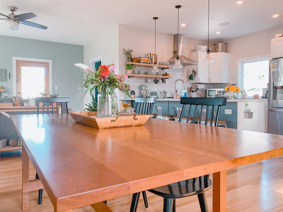 Dining area for 8 adjacent to full kitchen with additional island seating