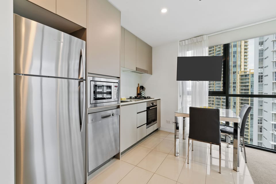 Prepare quick bites in the compact yet efficient kitchen complete with a gas stove, oven, microwave, full-size fridge, and dishwasher.