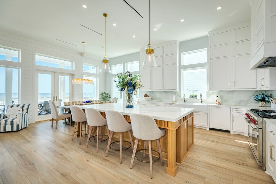 Easily serve homecooked meals on the large kitchen island or to the adjacent dining table