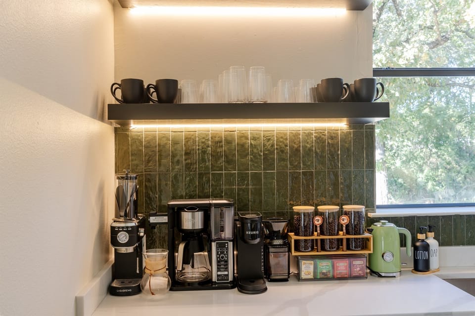 Mornings made easy for your whole group. The dedicated coffee bar features Espresso Maker, Keurig, drip coffee, pour-over, and premium teas at this Texas Airbnb near Dallas. Thoughtful details for family reunions and retreat weekends in DFW.