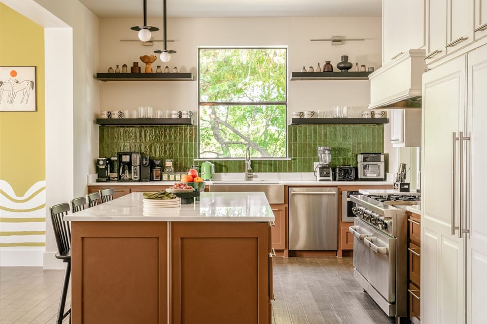 Built for groups who love to cook together. The chef's kitchen features a 6-burner range, double ovens, and 12-foot island at this luxury Texas vacation rental near DFW. Designed for family reunion feasts and group celebrations near Dallas.