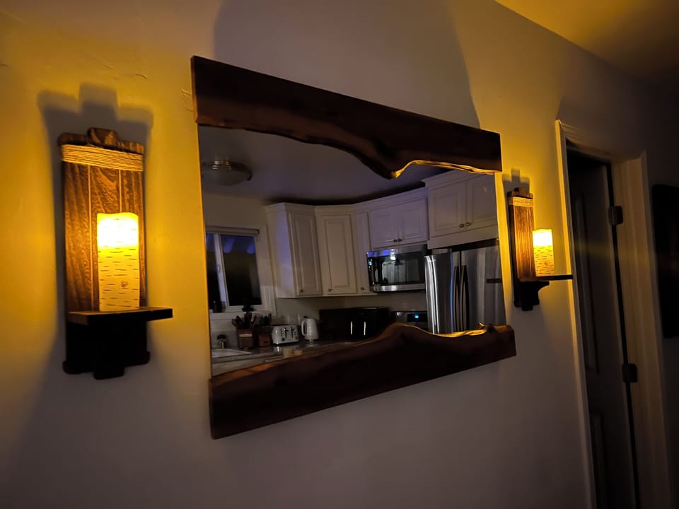 Live Edge Custom wooden mirror.. mounted in the kitchen area.