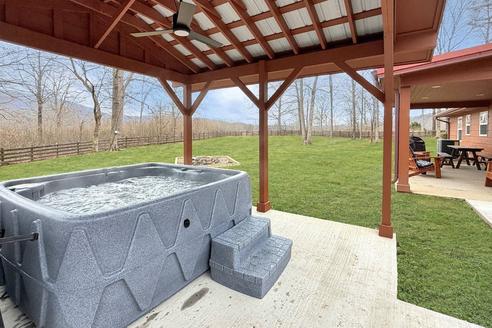 Enjoy the amazing and private view of mountains from the hot tub, by the fire pit or under the covered patio