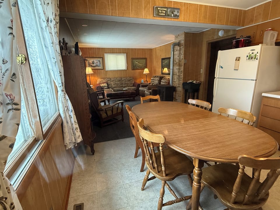 Kitchen has seating for 8, large window with lake view. Dish soap & new sponge.