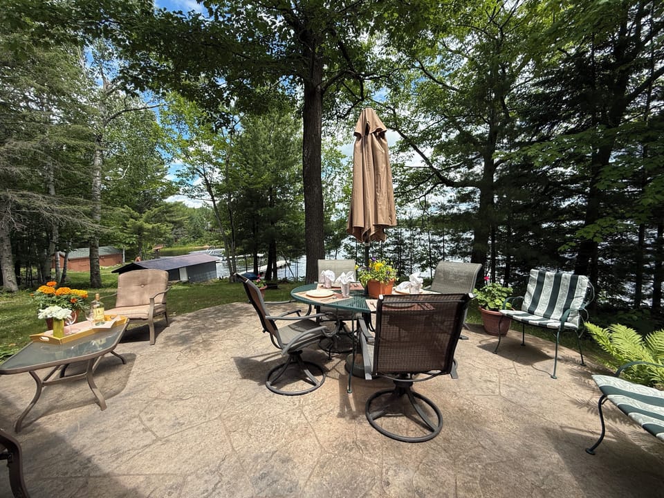 Private patio facing boathouse, dock and Moore's Bay on the lake. 
