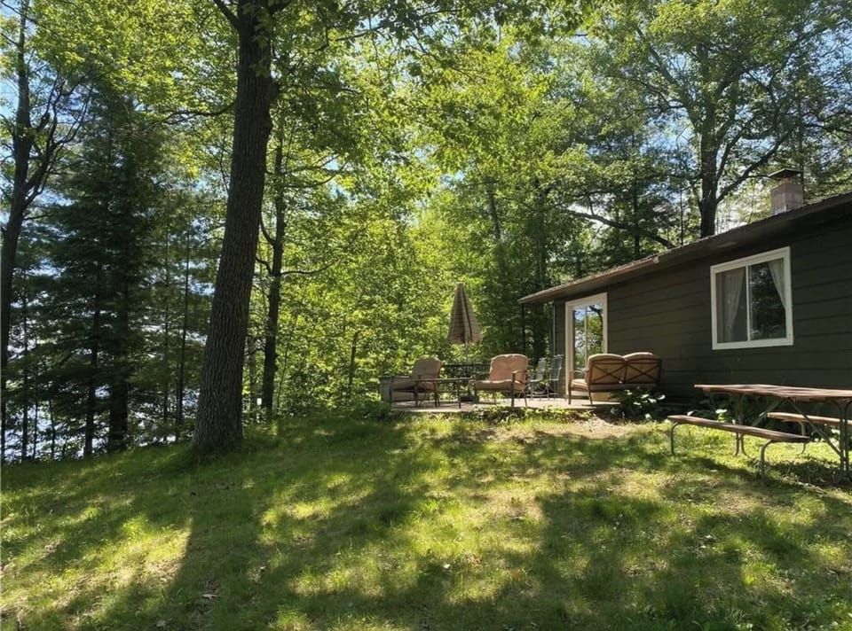 Lake facing side of patio.  Lake is 40' from S side of cottage.