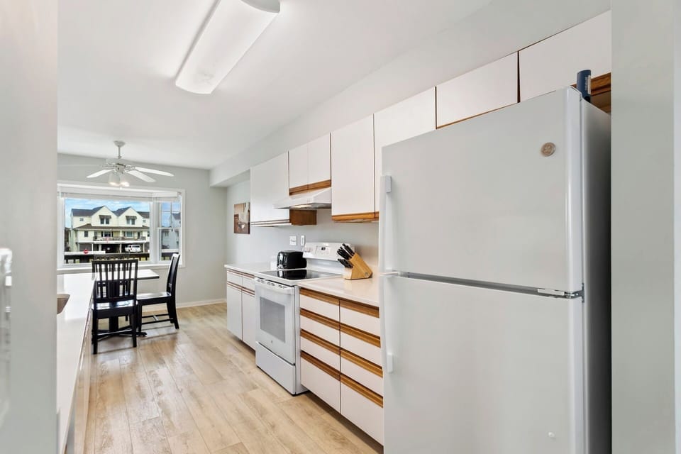Cook up your favorite coastal meals in the well-stocked kitchen featuring modern appliances and plenty of prep space.