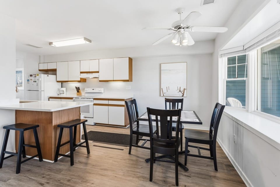 Dining & Game Table: Smaller dining-style table that doubles as a game and activity space—ideal for board games, puzzles, card games, or remote work.