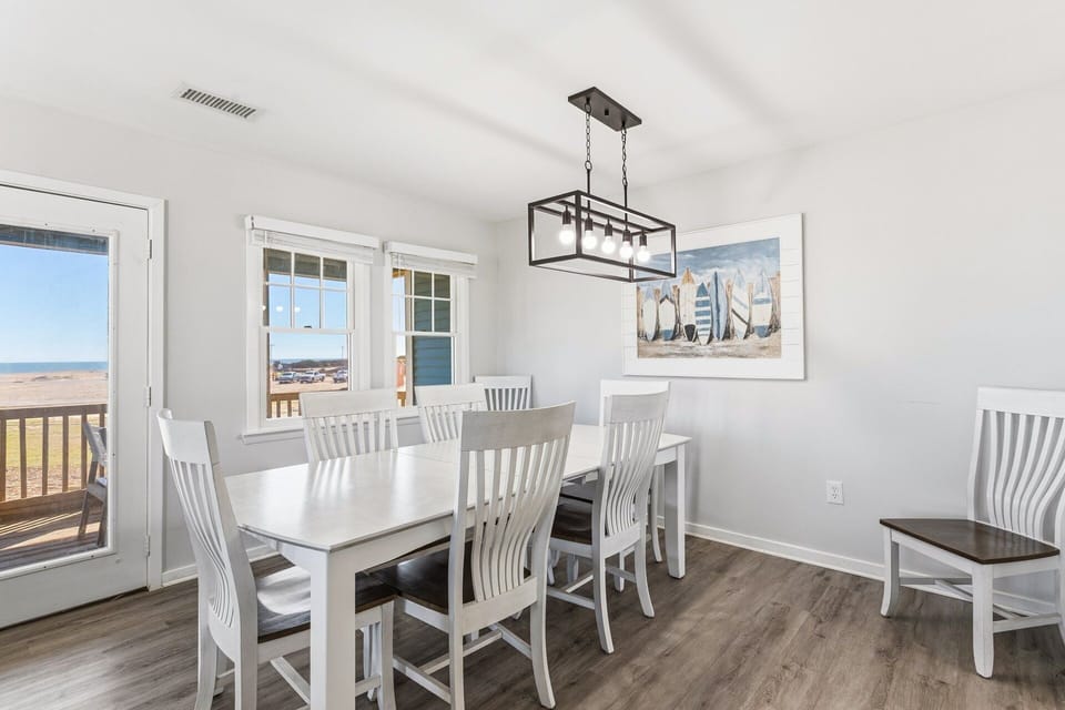 Gather around the dining table for shared meals, games, or planning your next Outer Banks adventure.