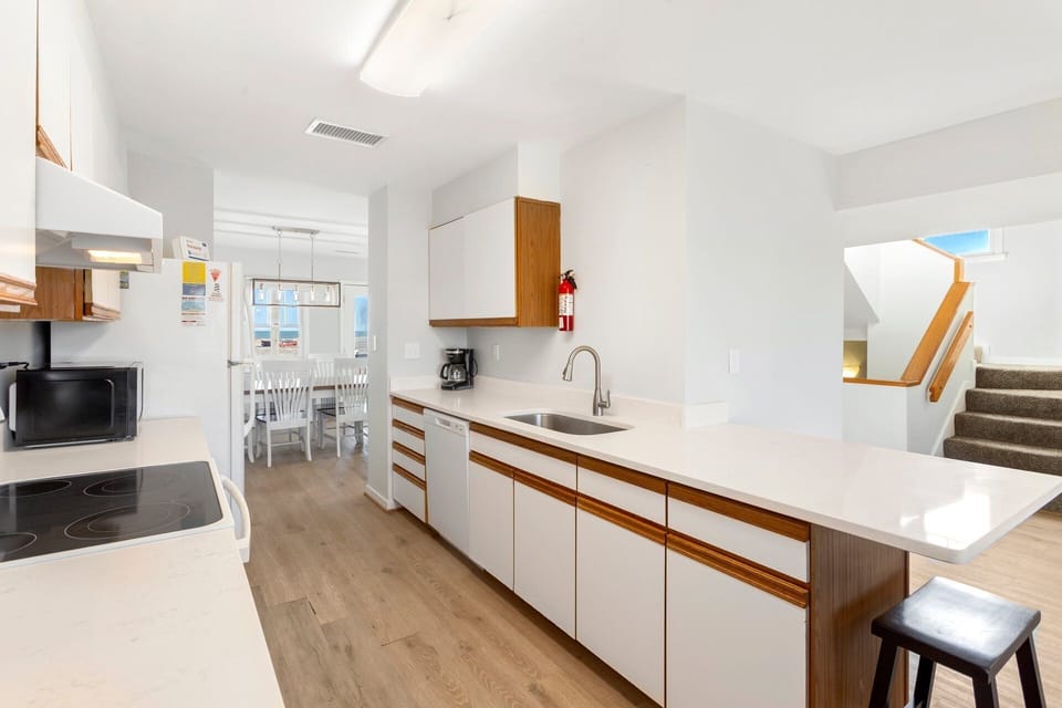 Cook up your favorite vacation dishes in the renovated kitchen with updated appliances, spacious countertops, and ample storage.