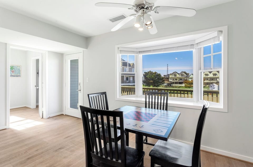 Dining & Game Table: Smaller dining-style table that doubles as a game and activity space—ideal for board games, puzzles, card games, or remote work.