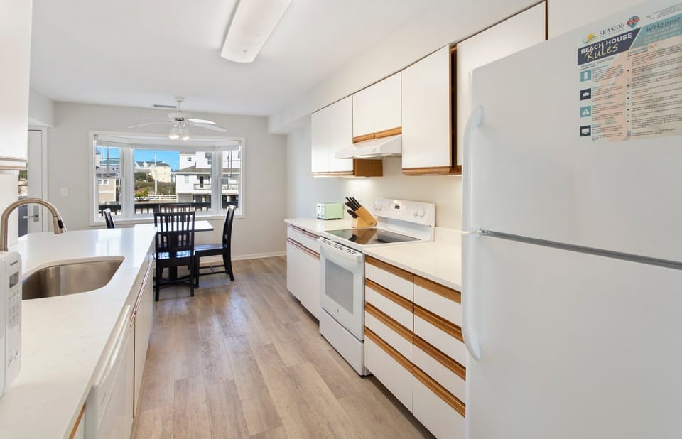 Main-Level Kitchen: Fully equipped kitchen with new appliances, plenty of counter space, and everything you need to cook at home.