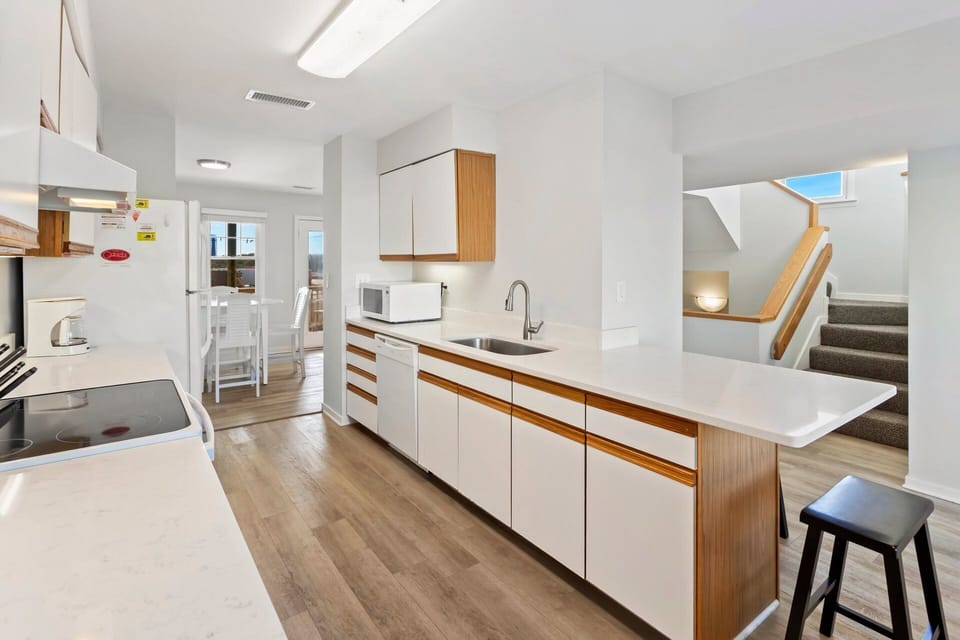 Main-Level Kitchen: Fully equipped kitchen with new appliances, plenty of counter space, and everything you need to cook at home.