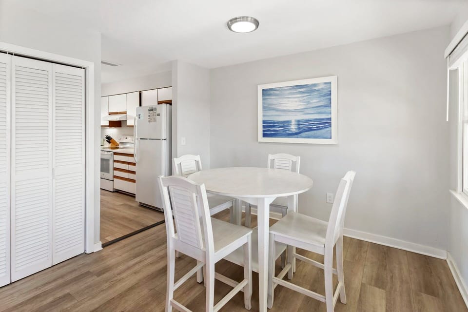 Main-Level Dining Area: A cozy dining space ideal for family meals or game nights after the beach.