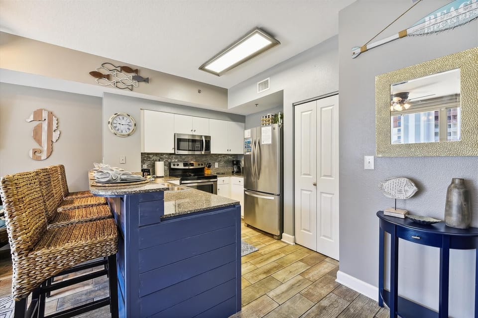 The kitchen with stainless steel appliances