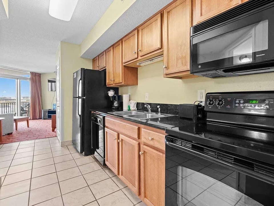 Enjoy home-cooked meals in this cozy, well-stocked kitchen.