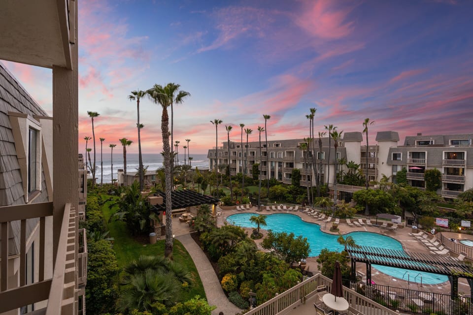 Tropical resort view under a pink evening sky