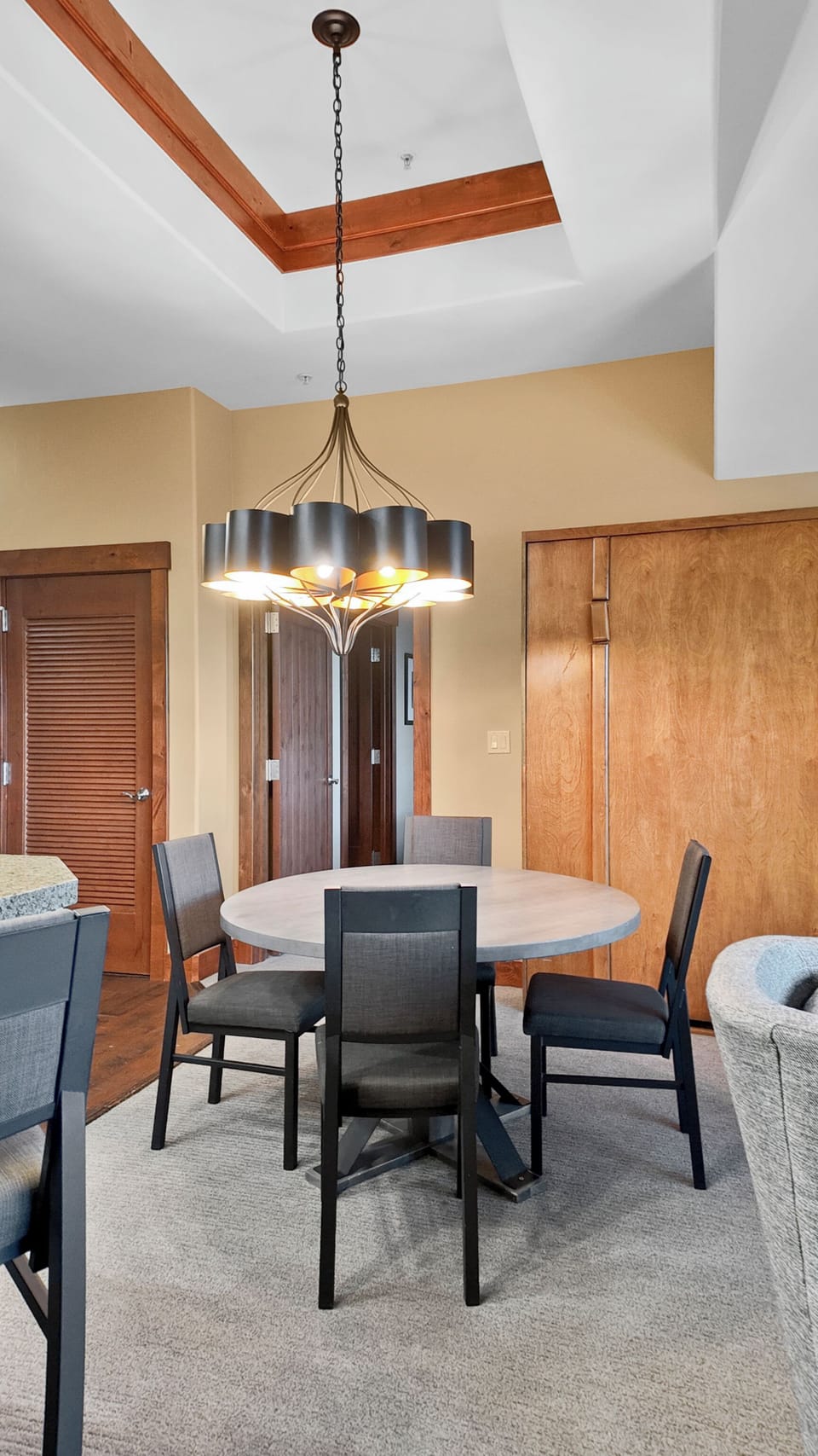 Spacious dining area with stylish lighting and comfortable seating