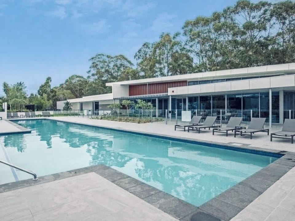 Resort style large pool with BBQ area, gym, sauna, golf simulator and cinema