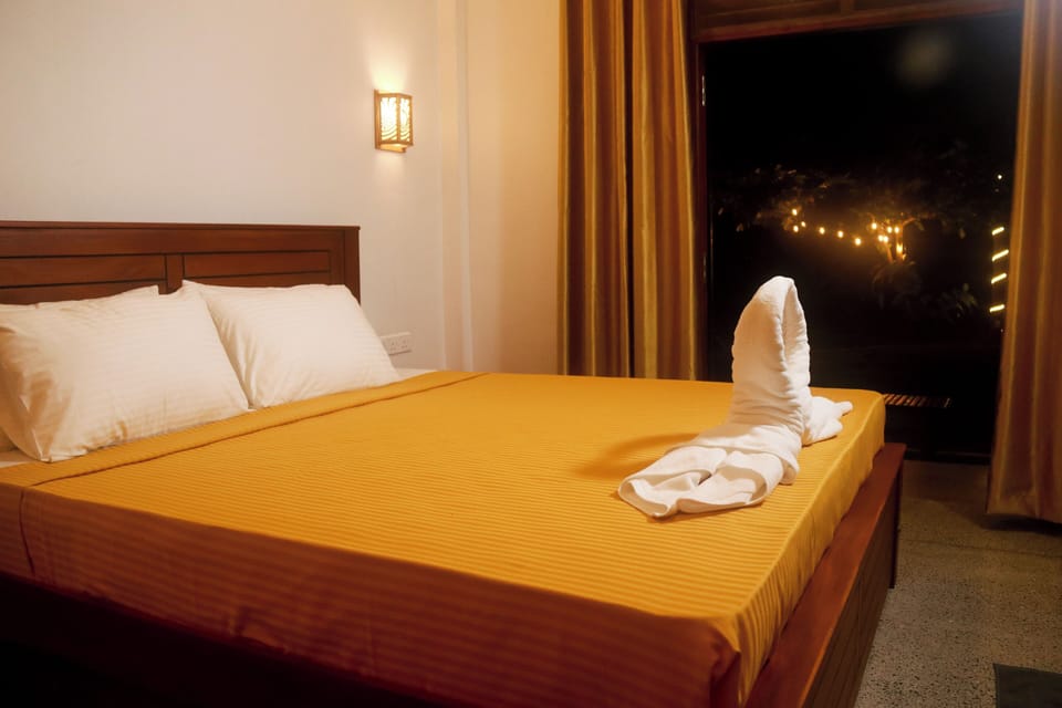 Deluxe Double Room, Ocean View | Desk, laptop workspace, iron/ironing board, free WiFi