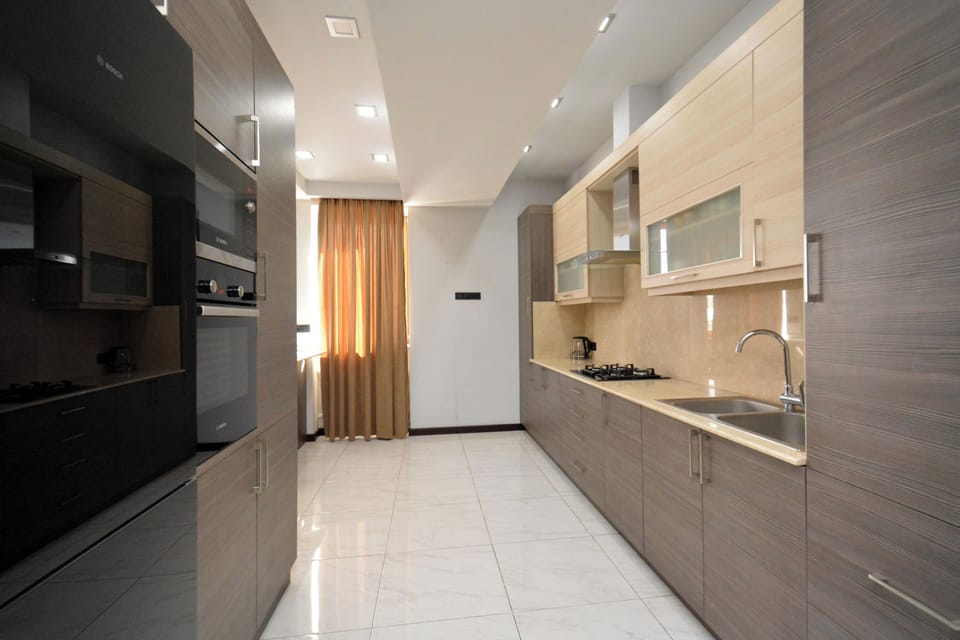 Family Apartment, Balcony, City View | Private kitchen | Electric kettle