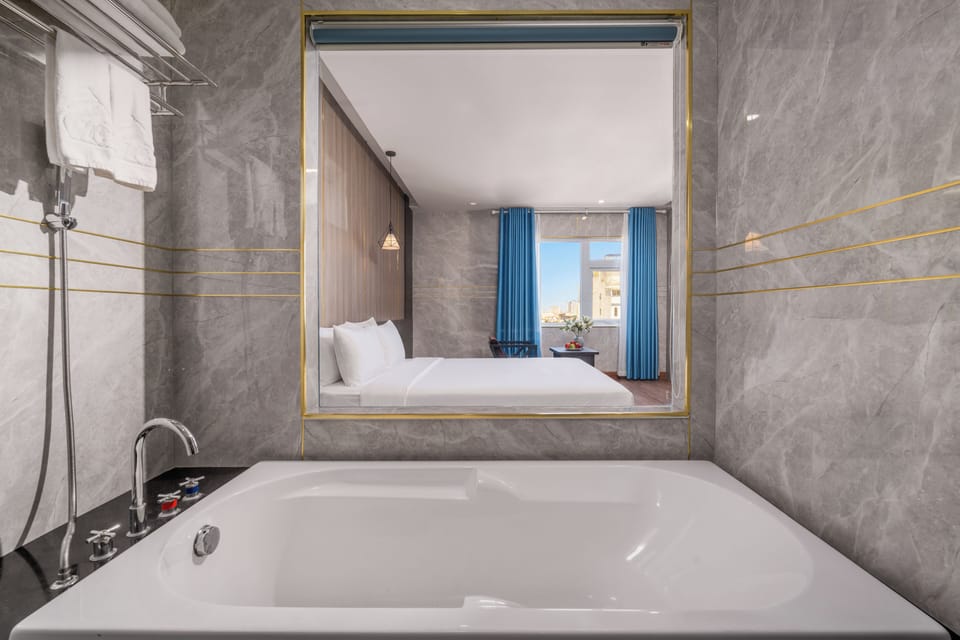 Suite Room Cityview with Bathtub | Bathroom | Hair dryer, slippers, bidet, towels