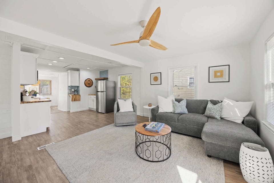 Living Room: Kick back in comfort! Spacious seating, warm light, and everything you need for quality time with your favorite people.