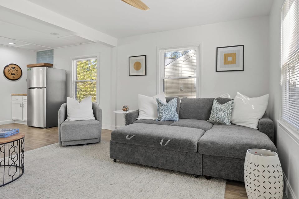 Living Room: Kick back in comfort! Spacious seating, warm light, and everything you need for quality time with your favorite people.