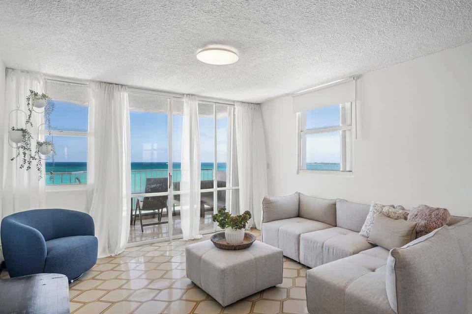 Your ultimate gathering spot! With abundant natural light and stunning ocean vistas, this living room is perfect for entertaining or simply unwinding with loved ones.