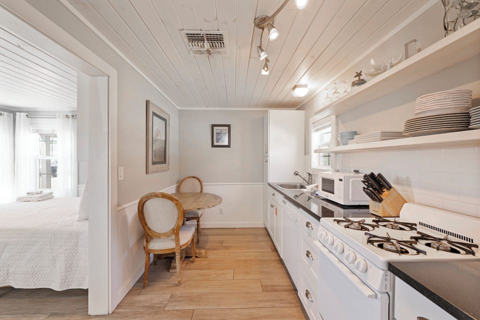 Your bright galley kitchen features modern appliances and charming wood beam ceilings, perfect for preparing meals during your stay.