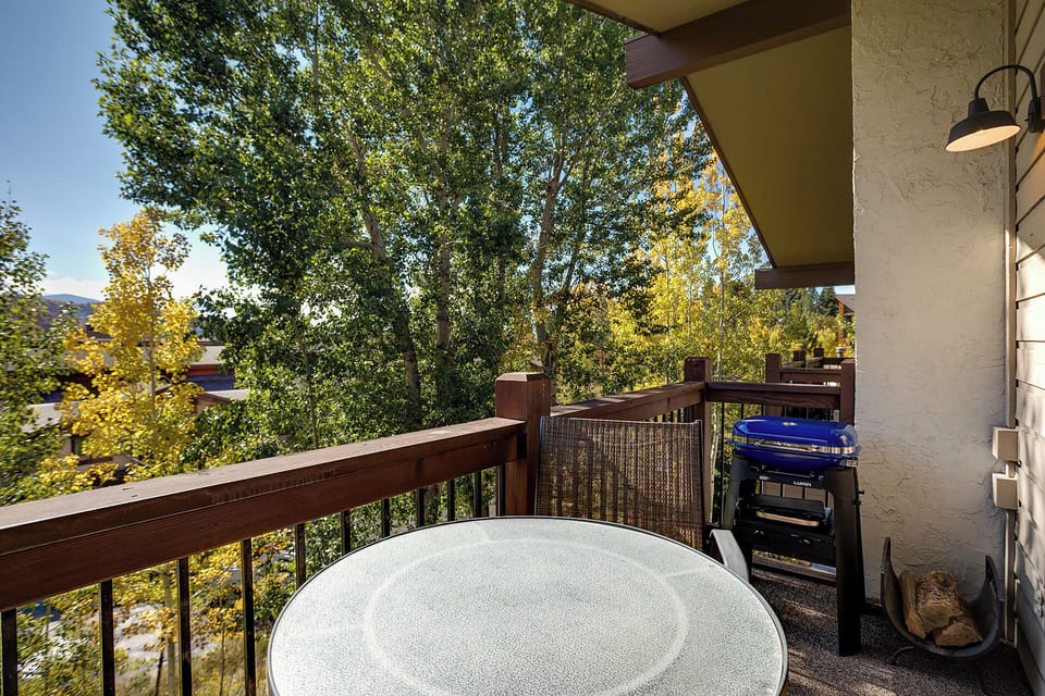 Your private balcony offers treetop views and a gas grill, perfect for morning coffee or evening BBQ sessions.