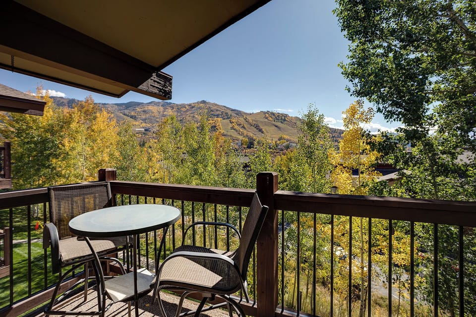 Sip your morning coffee at your private table while soaking in breathtaking mountain views and vibrant autumn foliage.