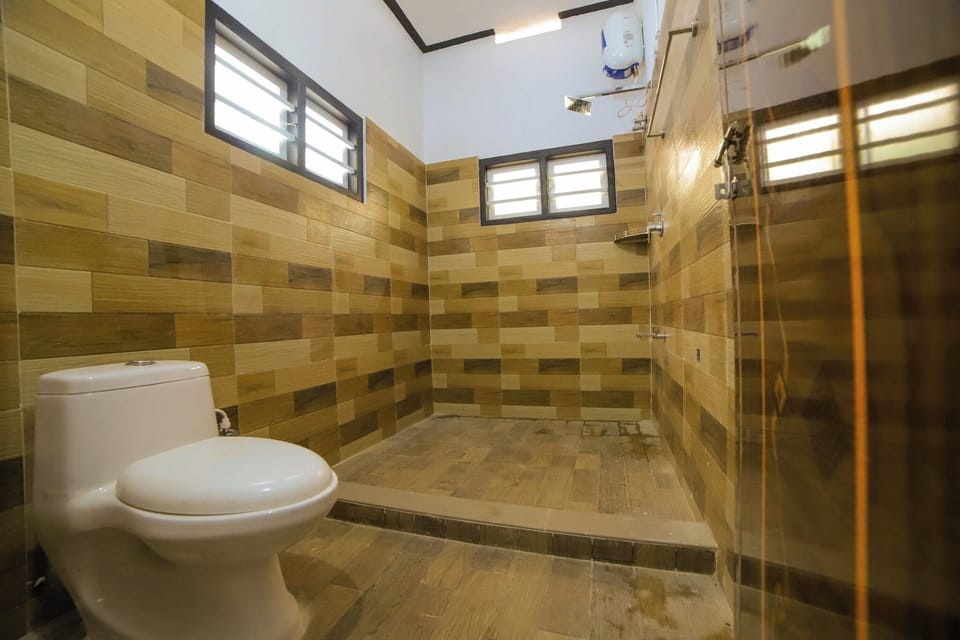 Shower, towels, soap, toilet paper