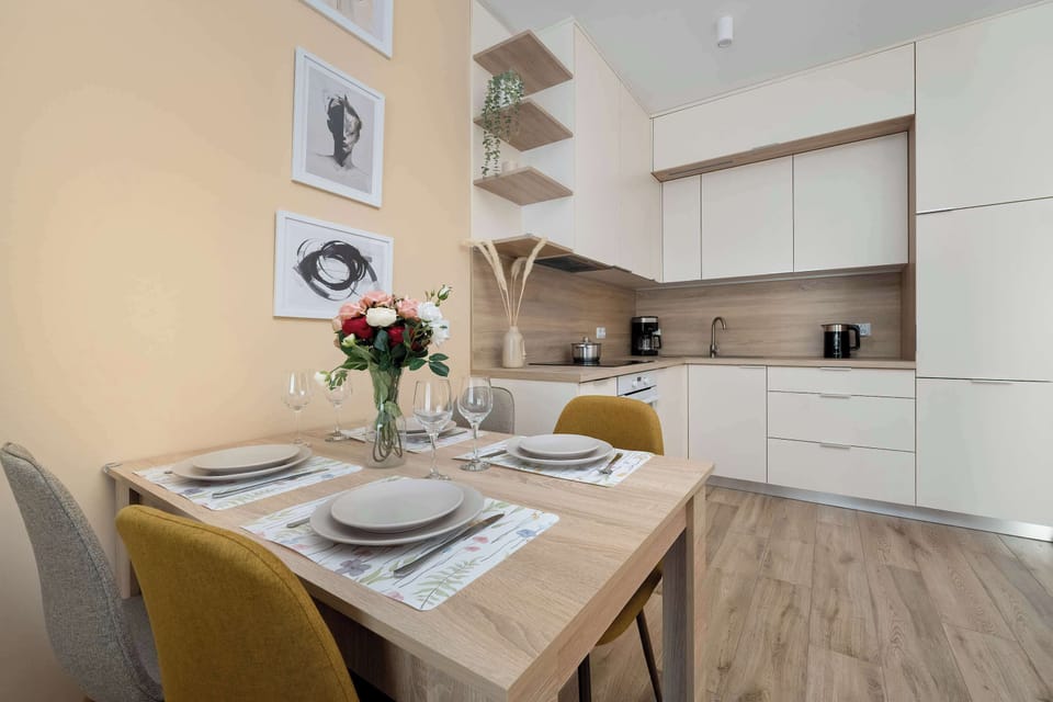 The sleek design of the kitchenette blending seamlessly with the living area.