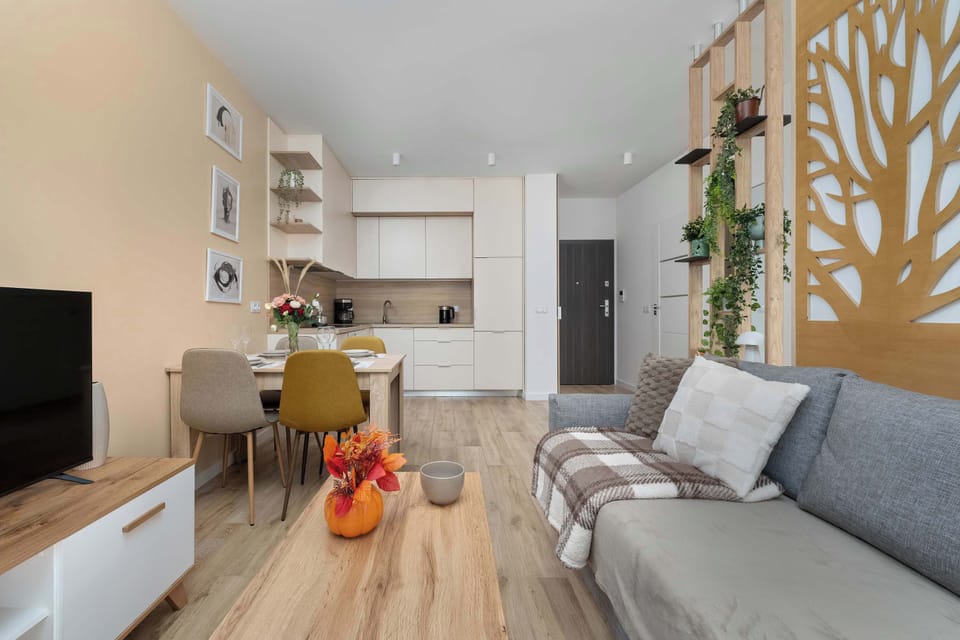 The elegant living area featuring a double sofa bed, perfect for relaxing or sleeping.