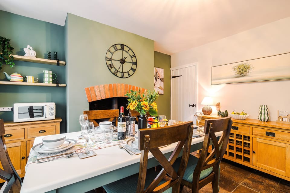 The dining room seats 5 people, perfect for families or friends getting together. Light the second log burner and enjoy your meal!