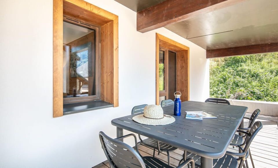 The inviting balcony dining area is perfect for enjoying fresh air and beautiful views.