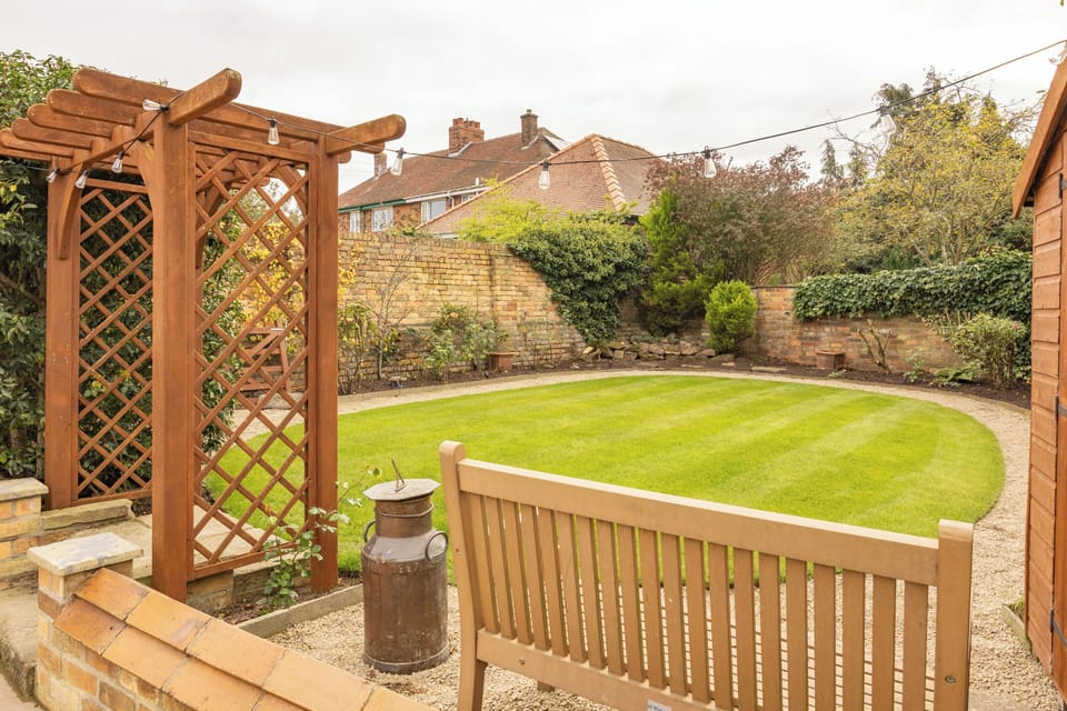 A peaceful garden retreat surrounded by greenery — perfect for relaxing and unwinding. 