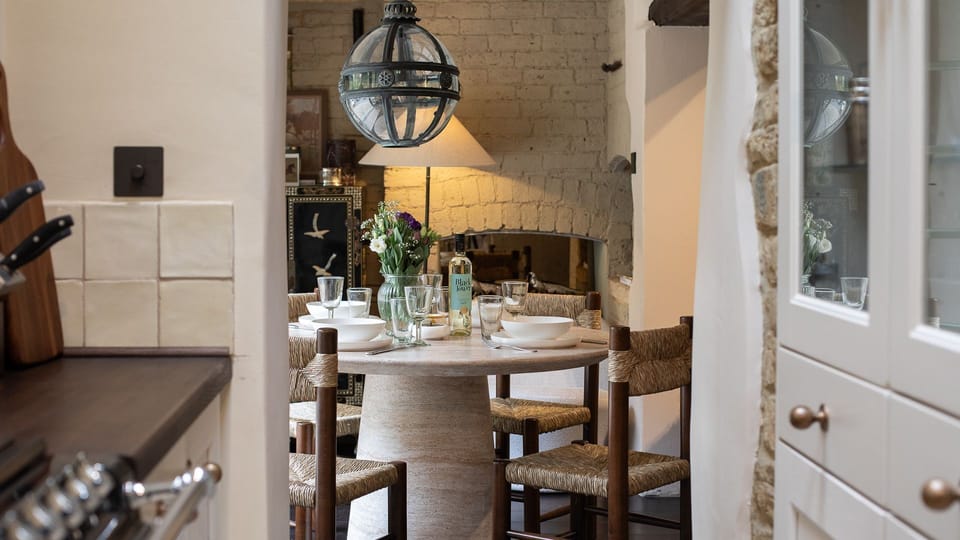 The dining table can be laid to seat four to six guests.