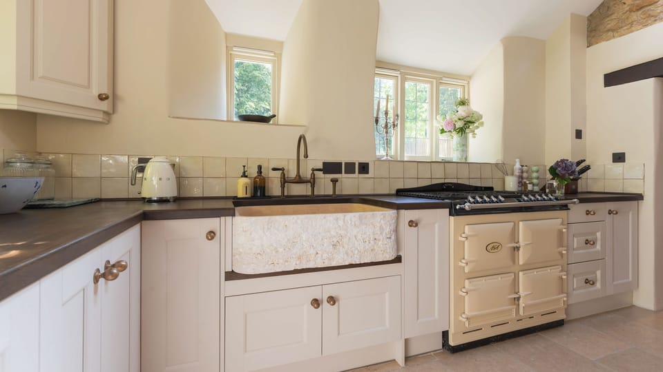 With an AGA, eye-catching Belfast sink and exposed stone wall the kitchen is full of intriguing details.
