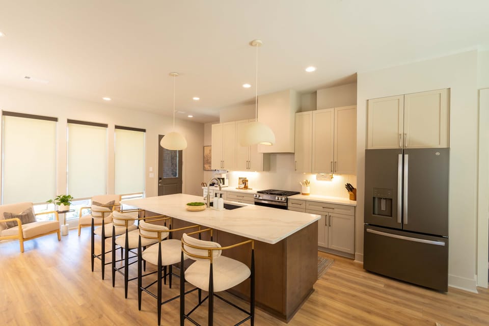 Full kitchen and privacy window treatments throughout