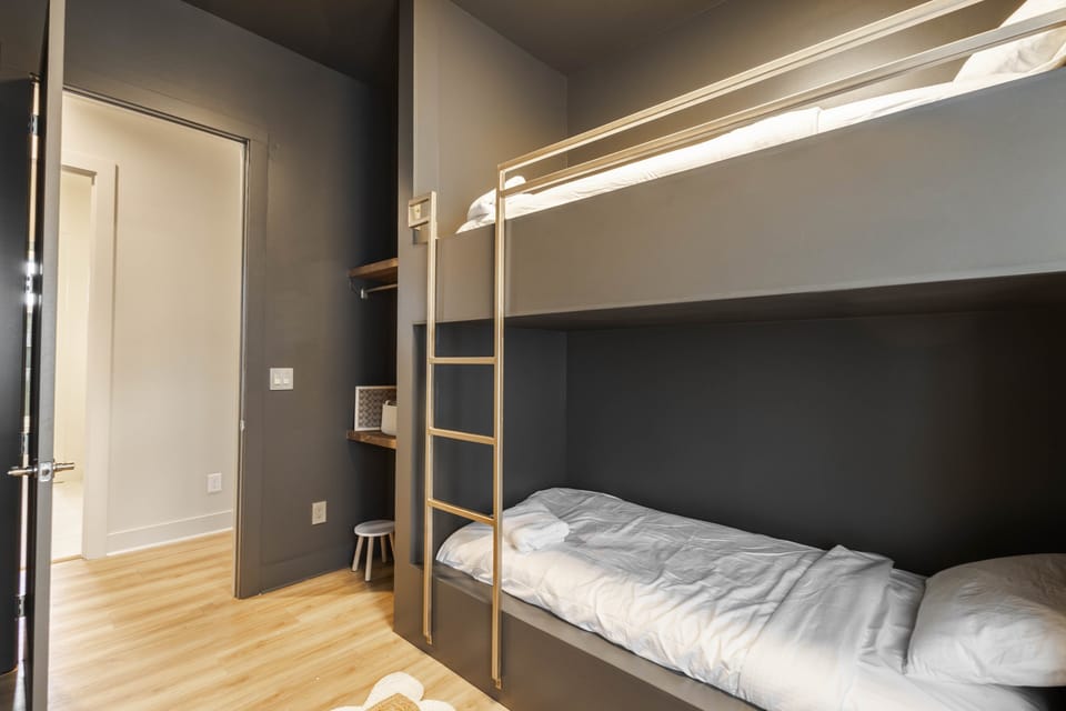 Bedroom 5 -Cozy bunk bed room with books, toys, and space for kids to enjoy